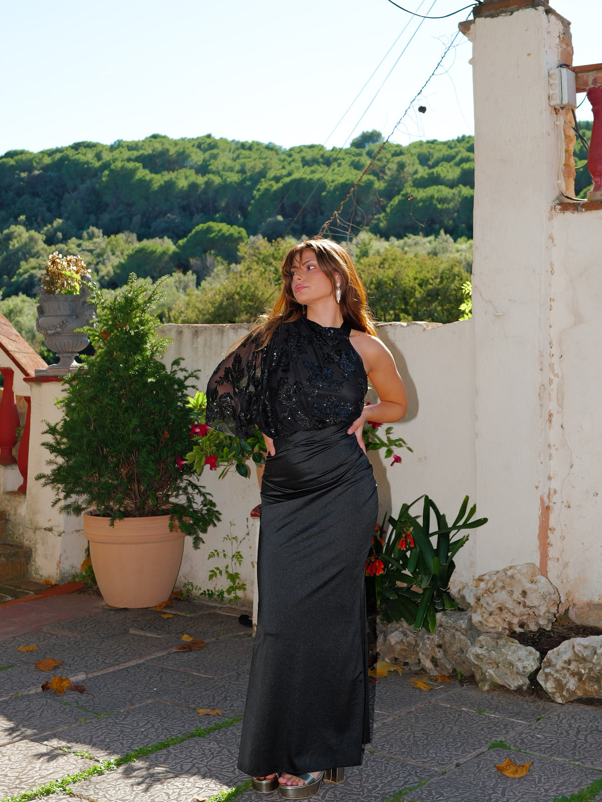 Black asymmetrical dress with puffed sleeves and sequins