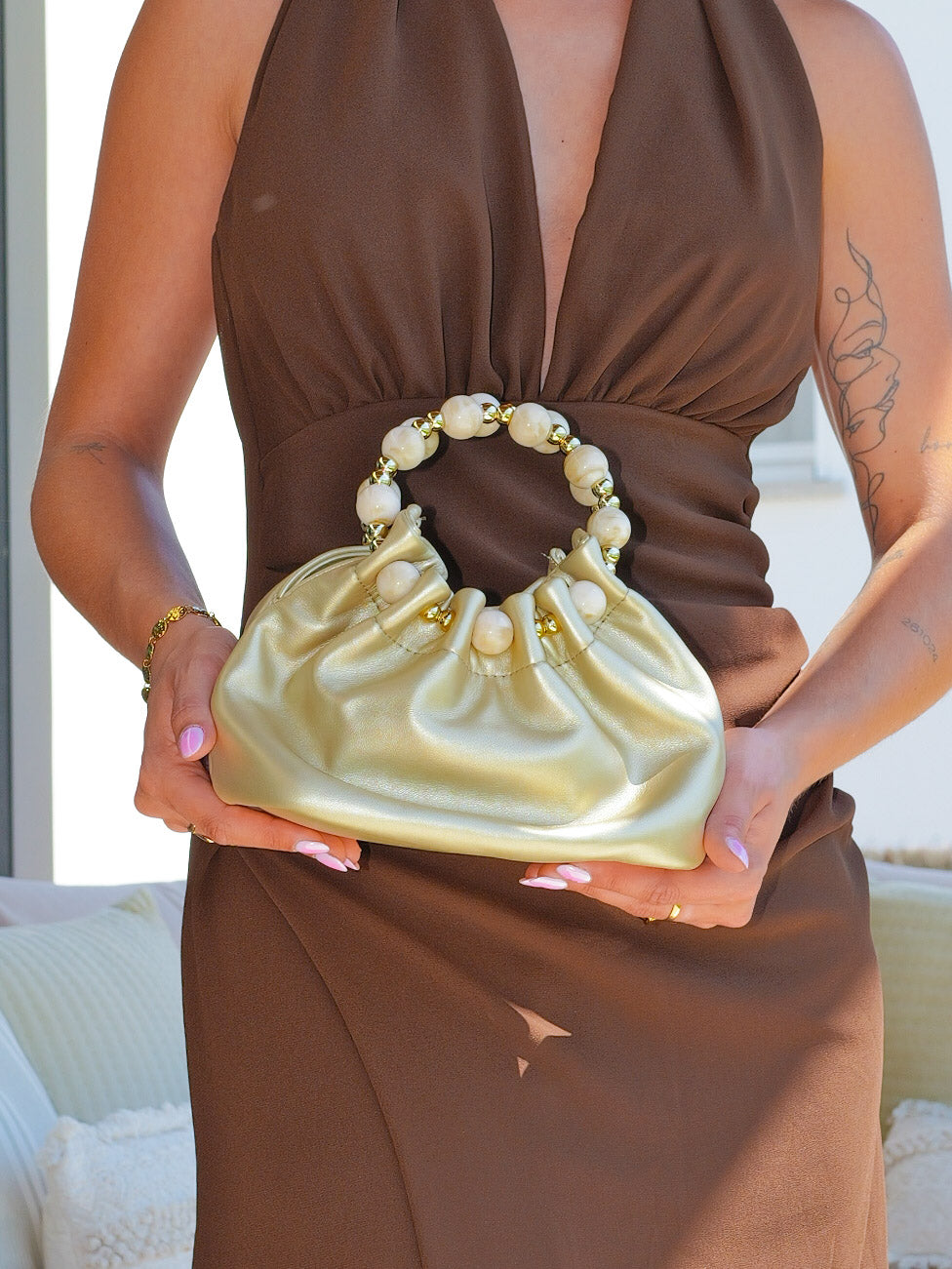 Clutch bombonera asa dorado