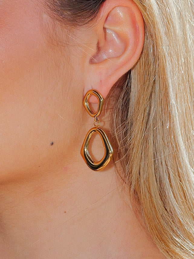 Gold asymmetrical oval earrings
