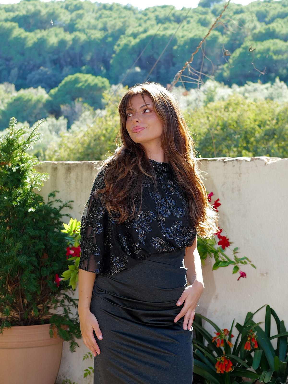 Black asymmetrical dress with puffed sleeves and sequins