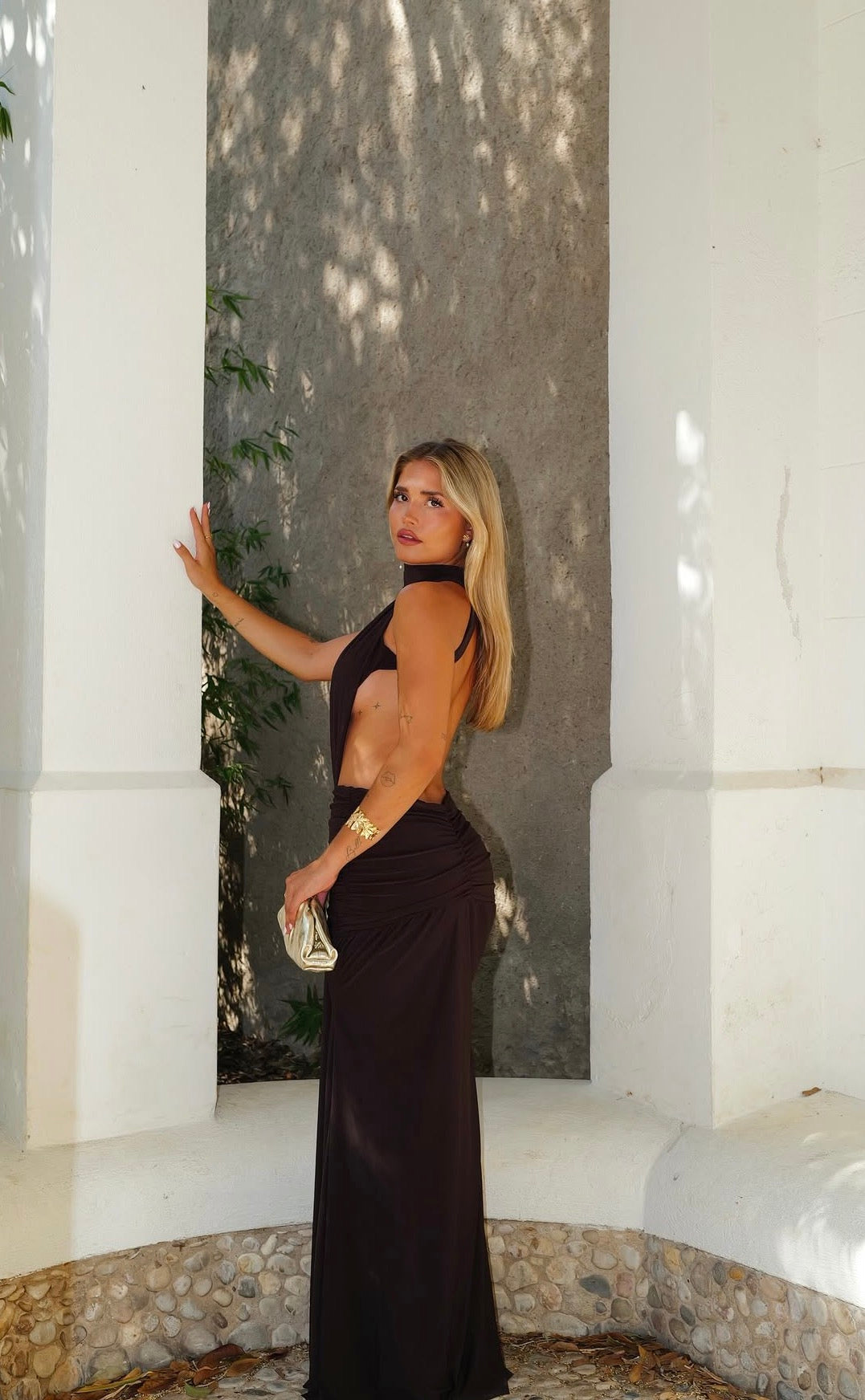 Chocolate-colored long halter dress with an open back