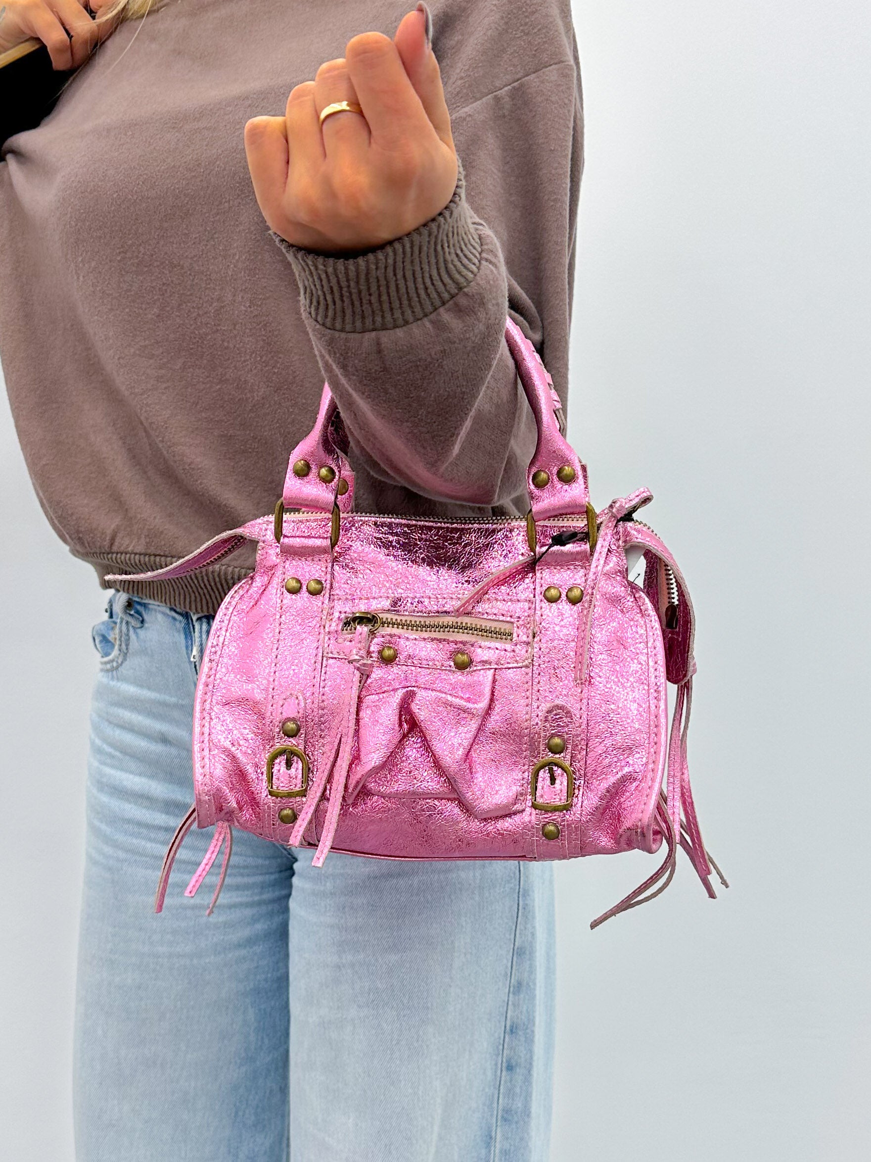 Pink shiny leather buckles bag
