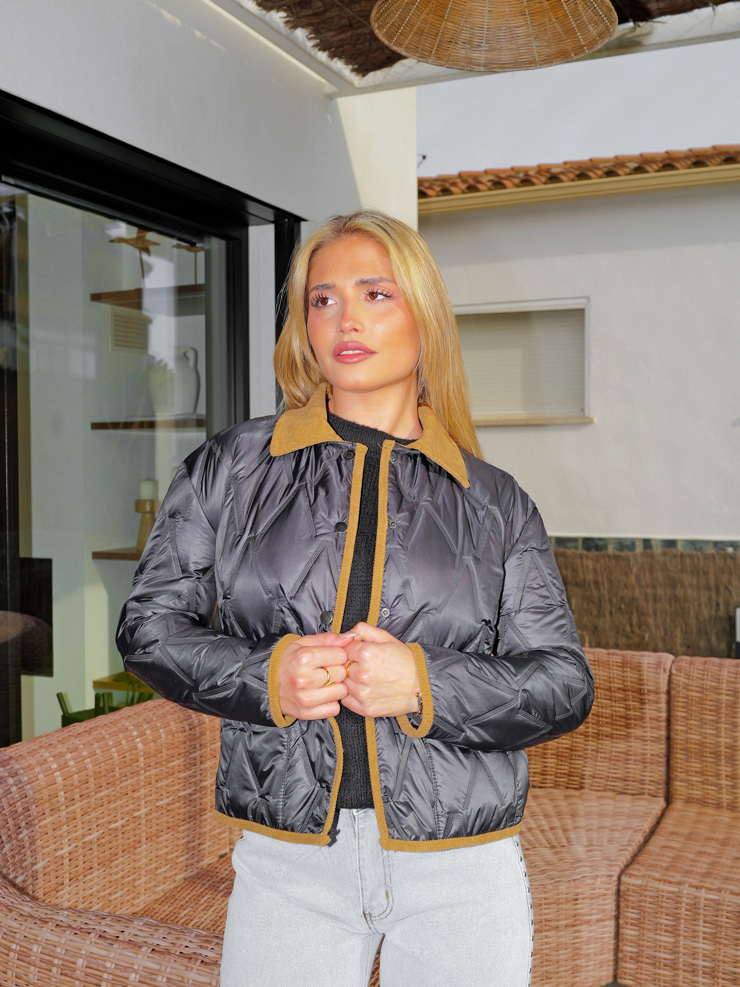 Black quilted jacket with pockets