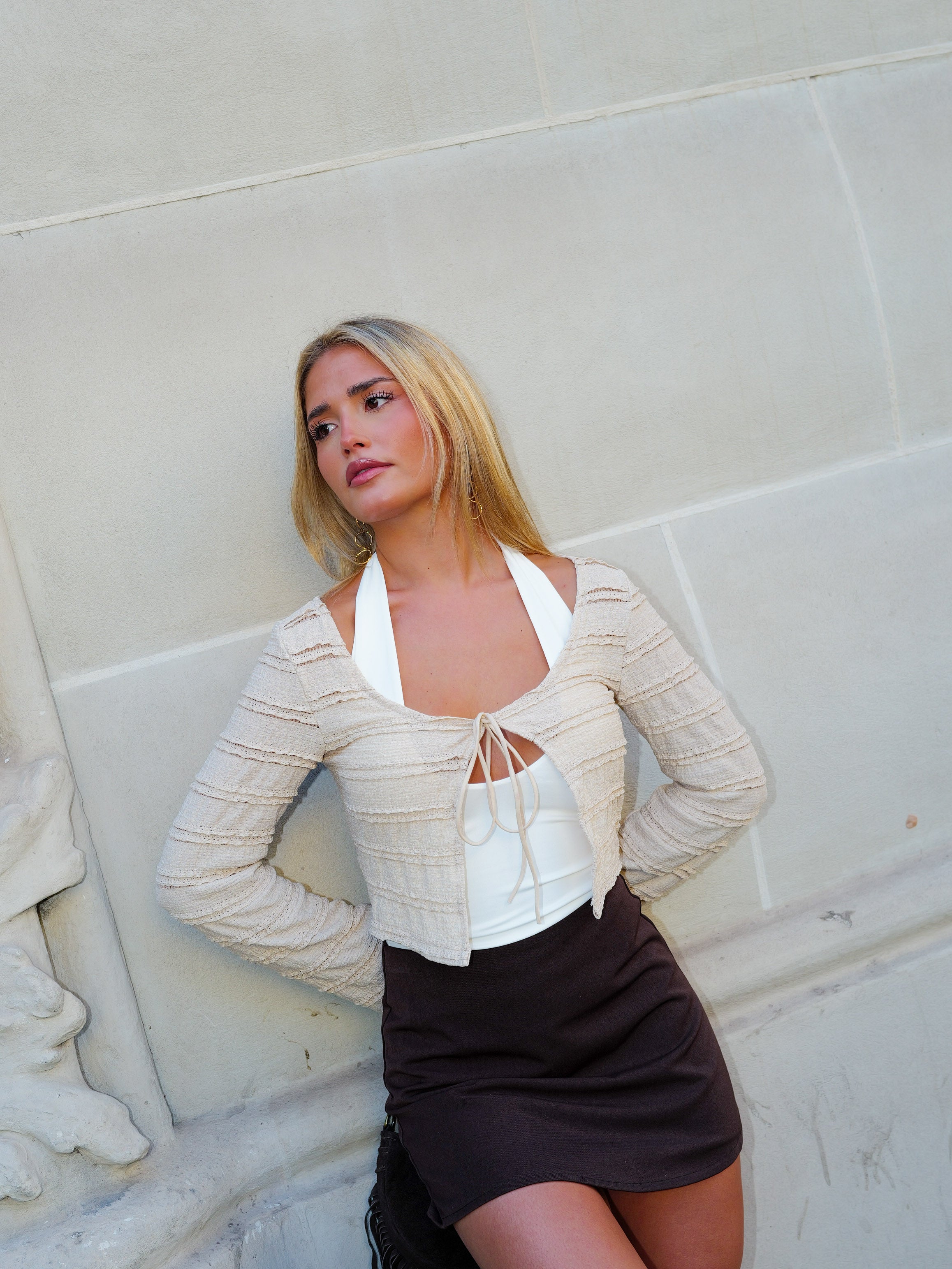 Cardigan con fiocco in pizzo beige