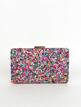 Clutch piedras colores dorado