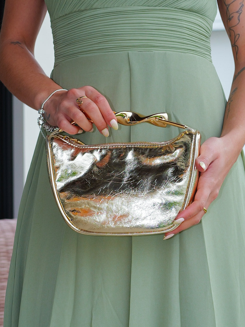 Gold half-moon clutch