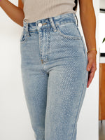 Jeans cropped brillos