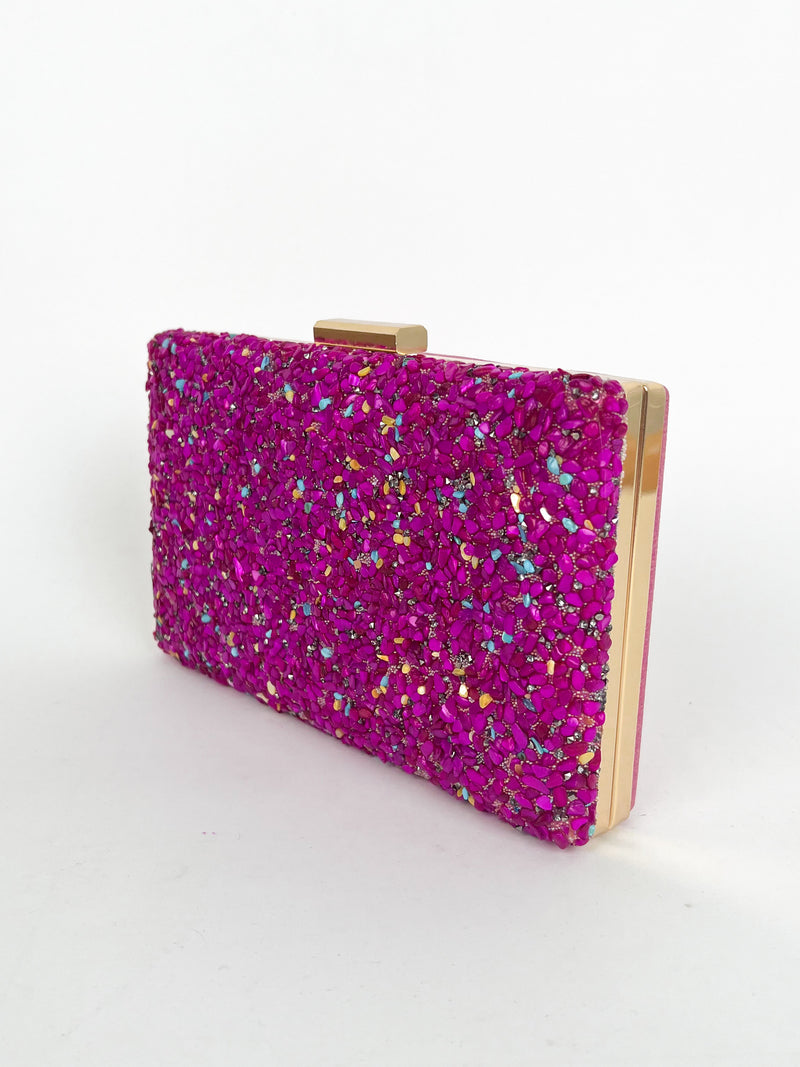 Clutch piedras fucsia