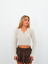 Cardigan botones brillos beige