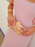 Clutch bandas colores dorado