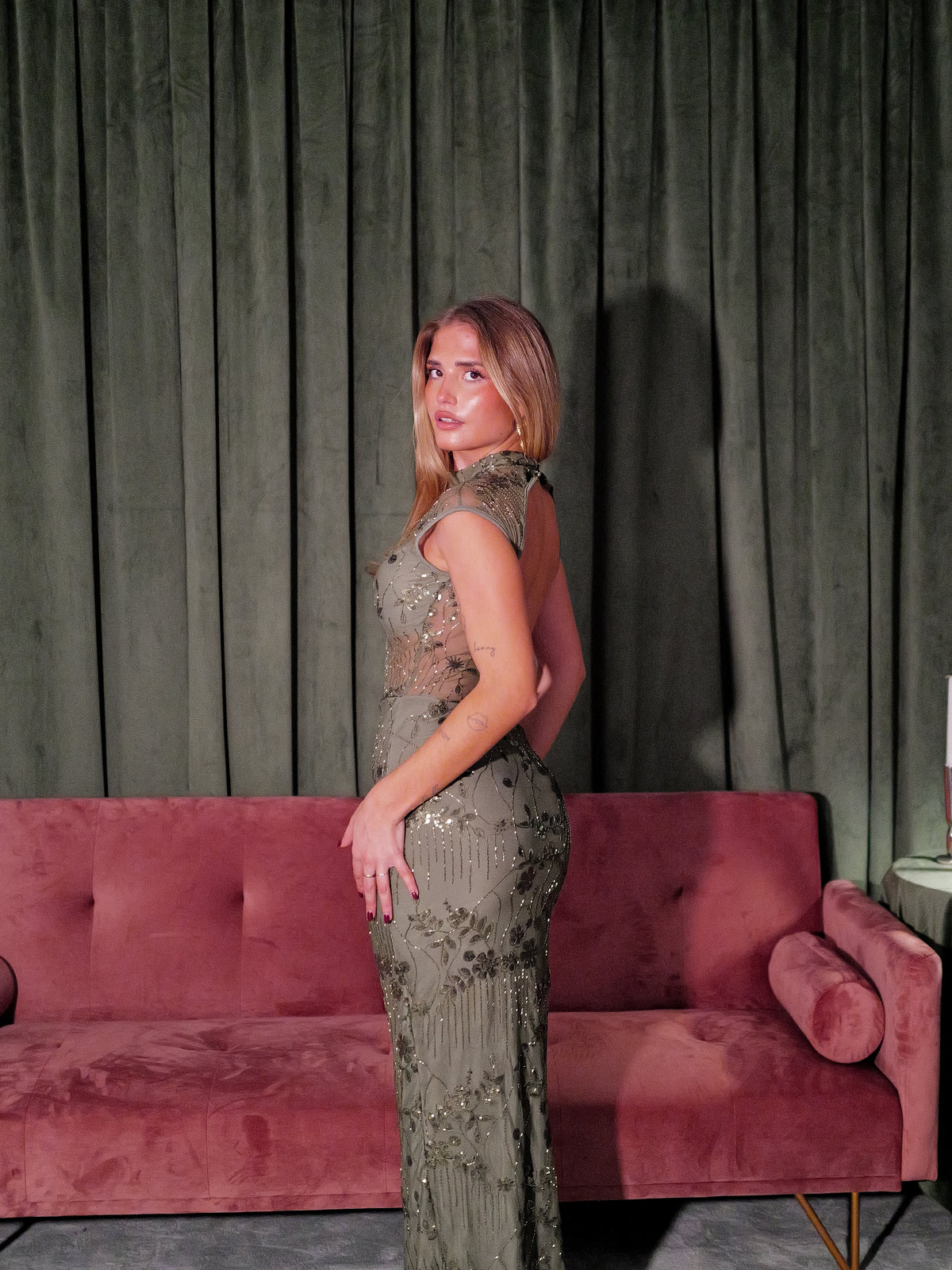 Long, sequined dress with a Perkins neckline in olive