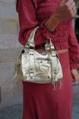 Bolso hebillas piel brillos dorado