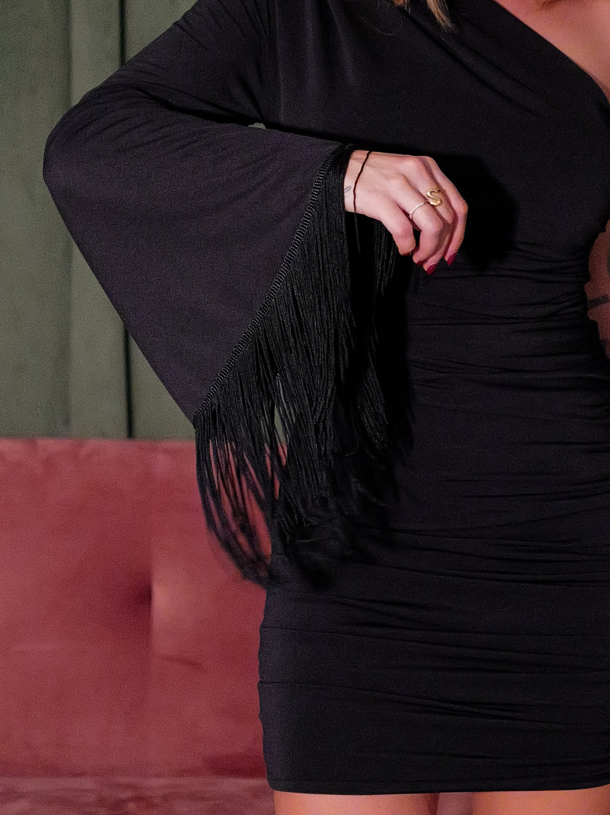 Black asymmetrical mini dress with fringed sleeves