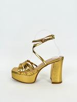 Sandal with golden straps platform heel