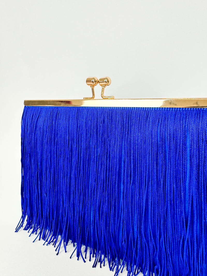 Blue fringed suede clutch