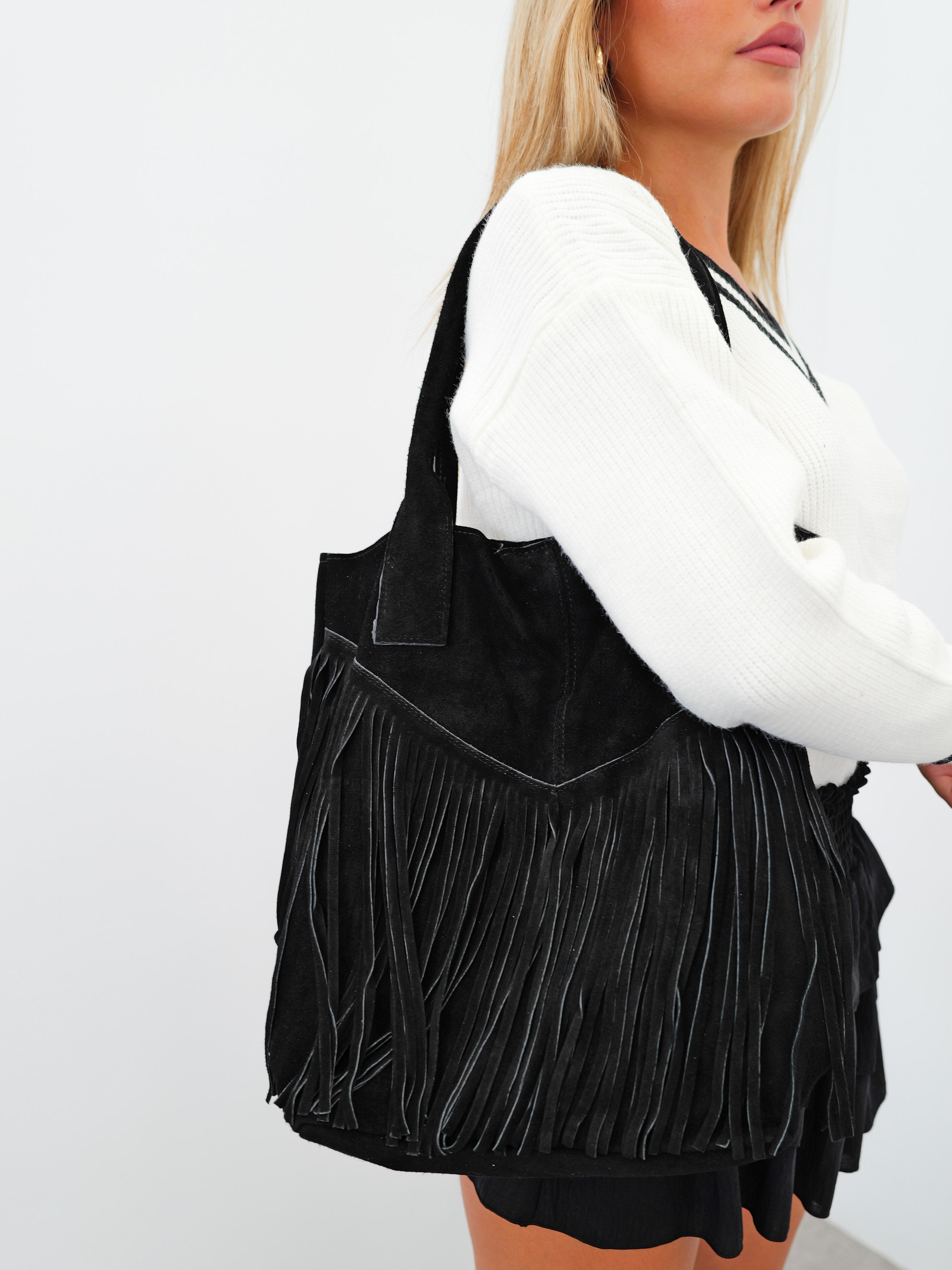 Black fringed suede bag