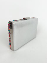 Clutch with silver colored stones