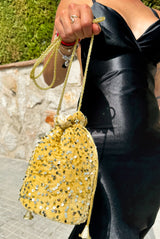 Gold sequin clutch bag