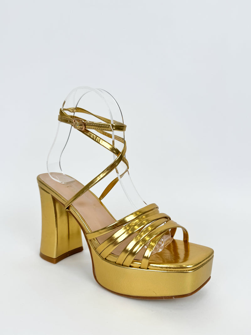 Sandal with golden straps platform heel