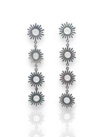 Silver suns cascade earrings