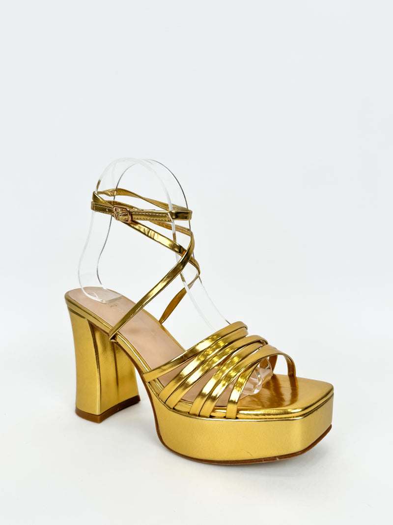 Sandal with golden straps platform heel