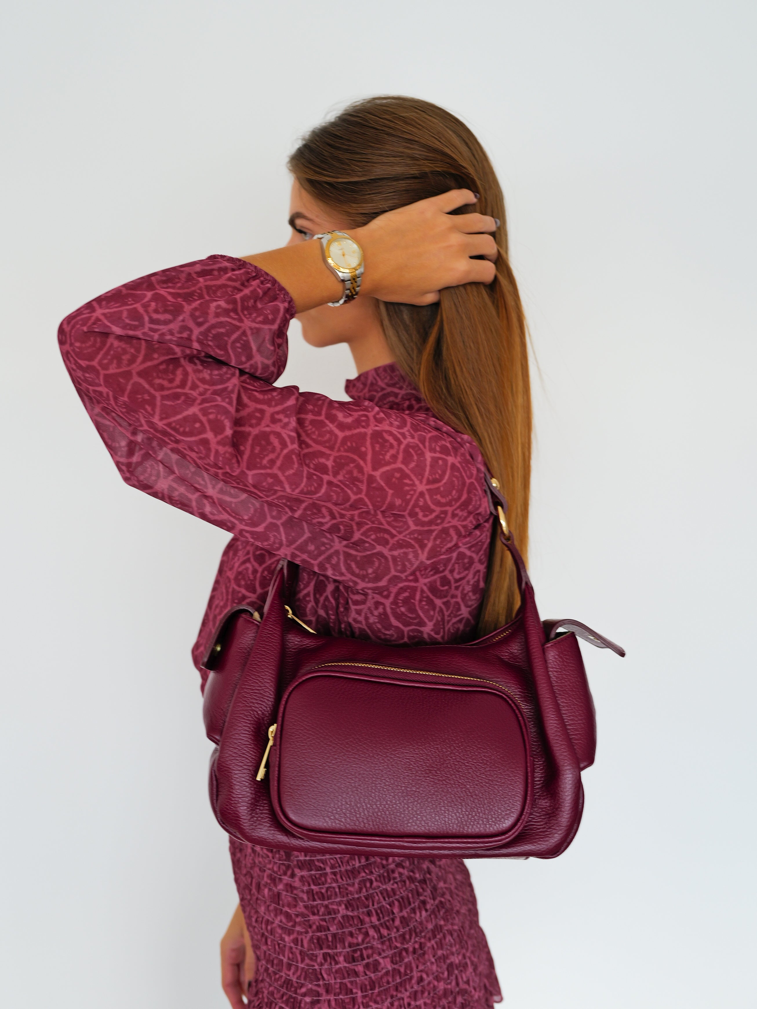 Burgundy leather handbag with pockets