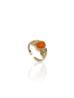 Golden ring with orange stone