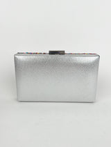 Clutch with silver colored stones