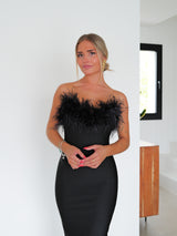 Tight-fitting black feather dress