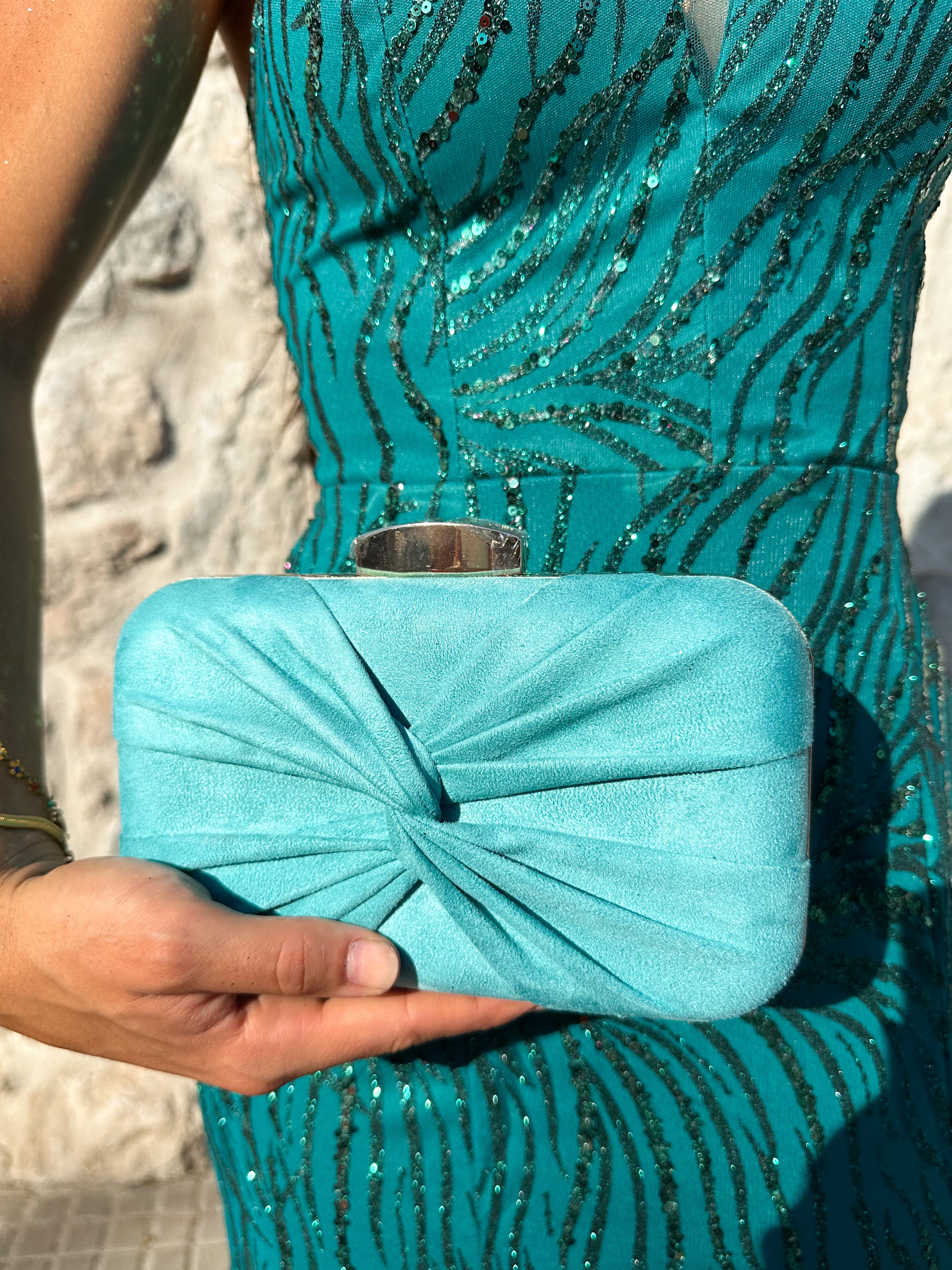 Turquoise cross bow clutch