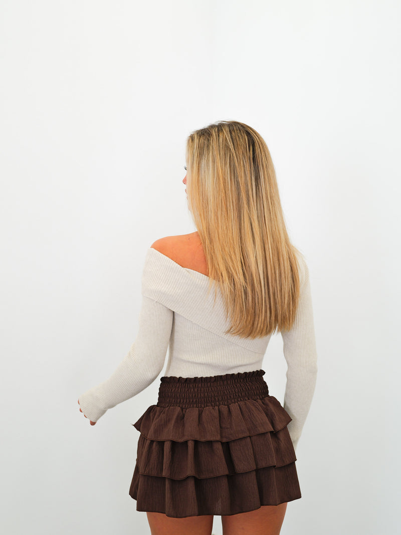 Pullover with beige asymmetrical ribbed band