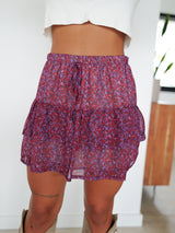 Mini skirt with burgundy ruffled bow