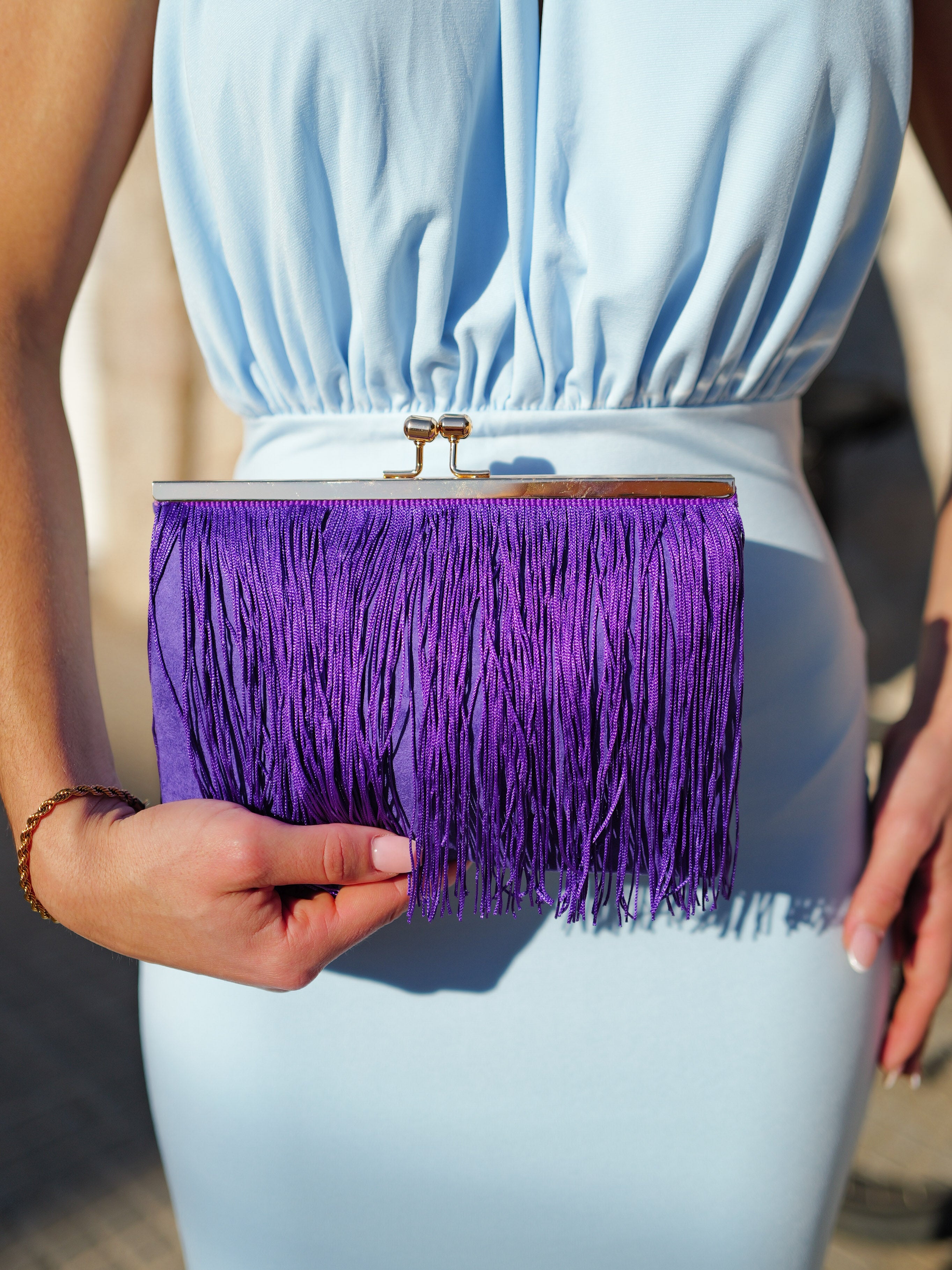 Purple fringed suede clutch