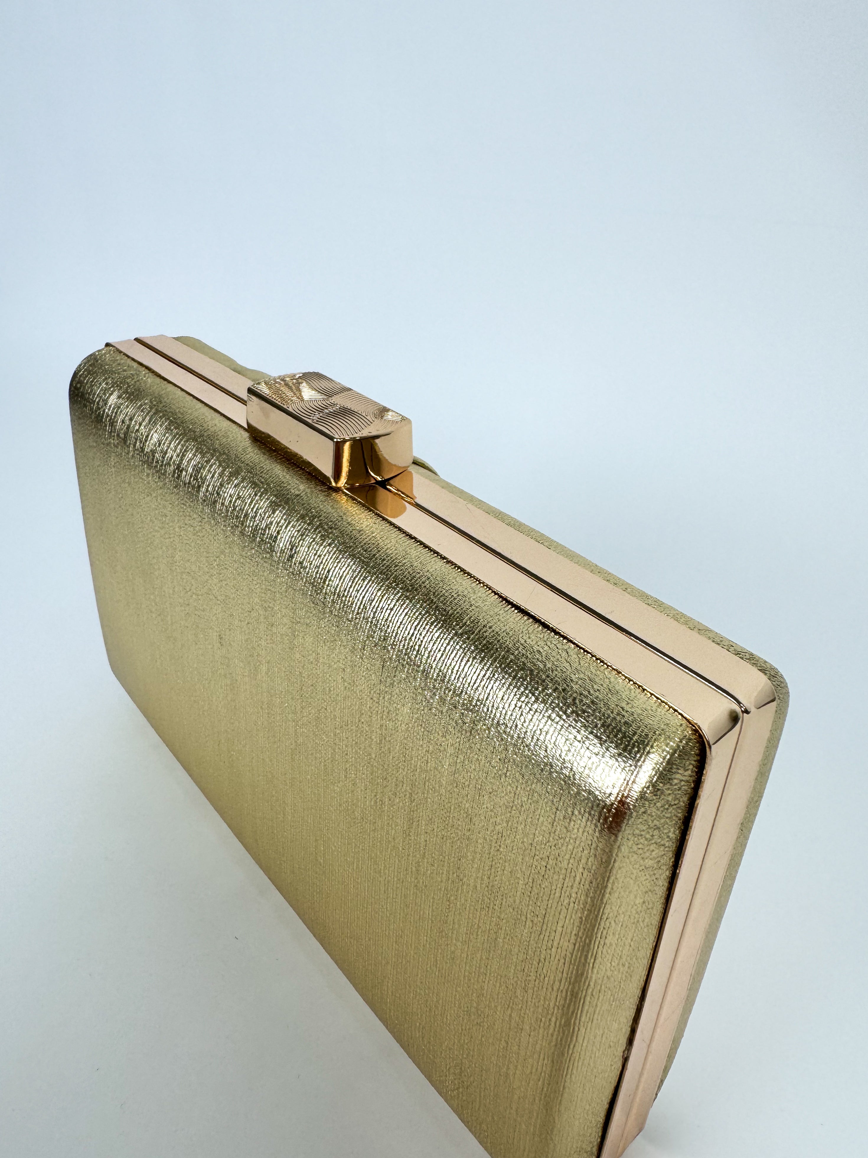 Gold banded clutch