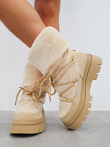 Beige furry ankle boots with laces detail