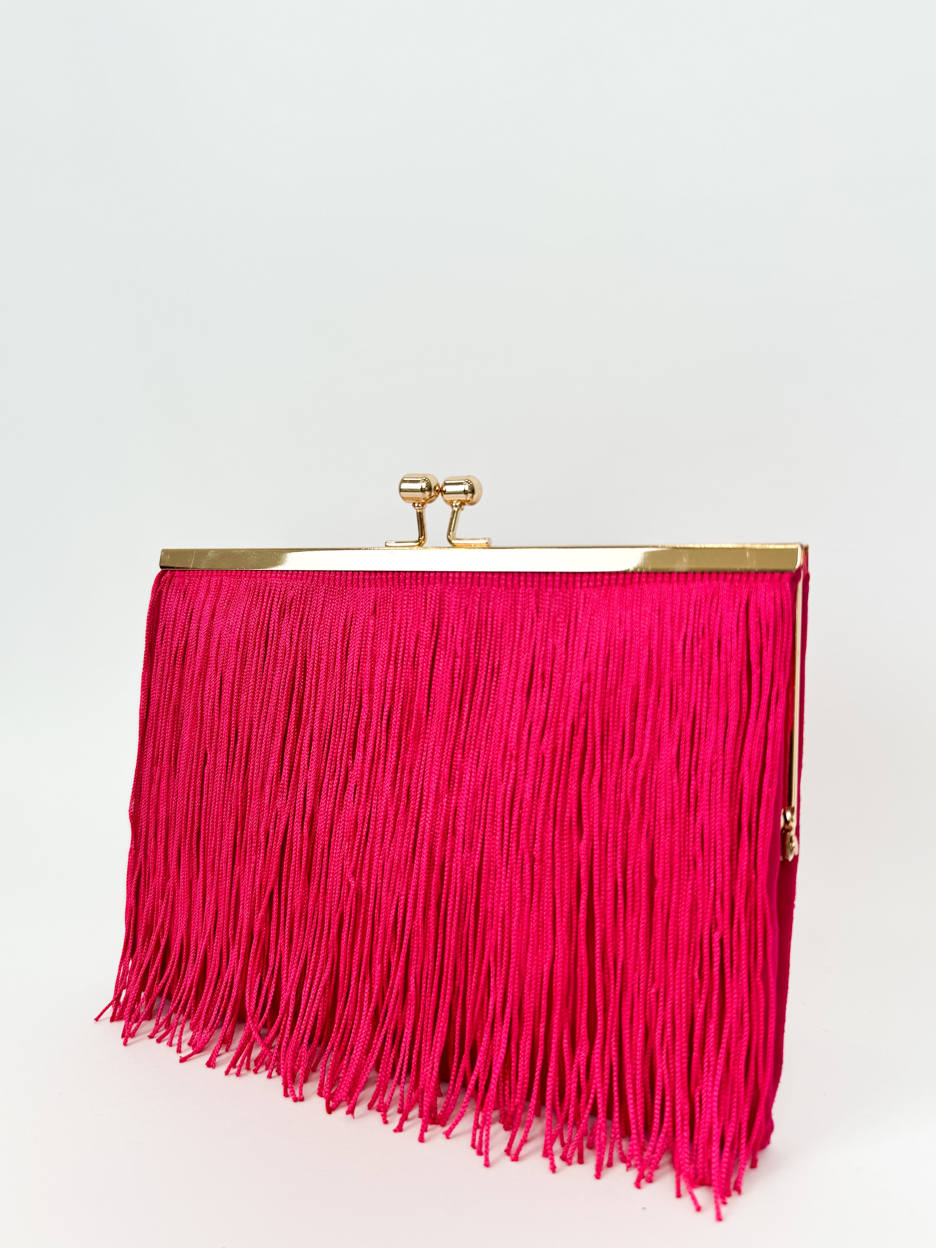 Fuchsia fringed suede clutch