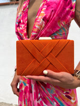 Orange braided clutch