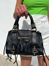 Black shiny leather buckles bag