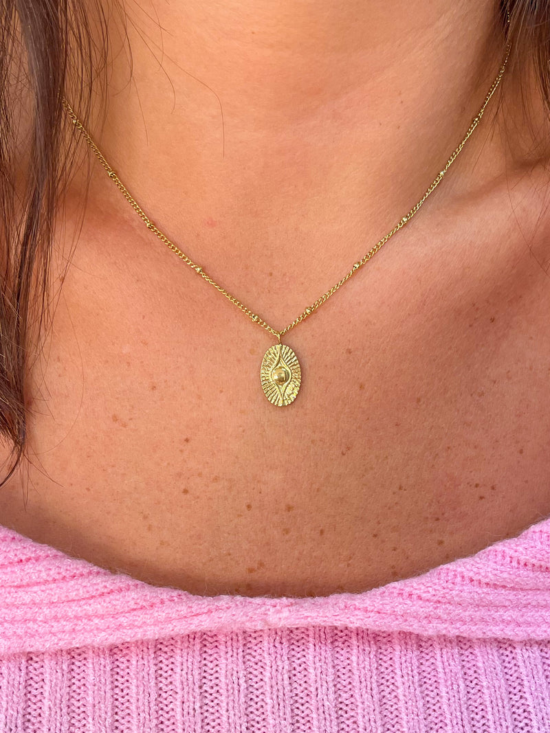 Fine gold eye medal necklace