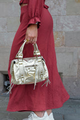 Borsa con fibbie in pelle glitterata oro