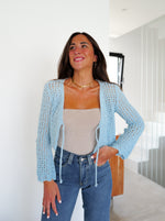 Mini cardigan con fiocco blu