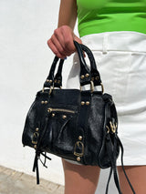 Borsa con fibbie in pelle nera lucida